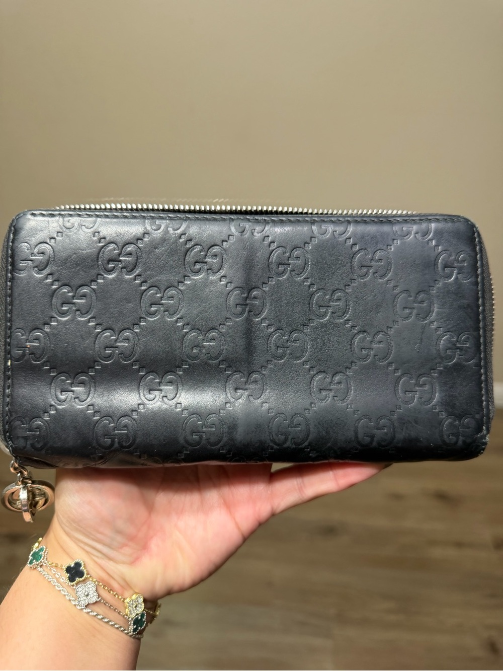 Gucci Black GG Embossed Zip Wallet with Charm